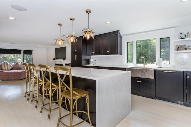 2 Overlook Rd, Canton, MA 02021 - kitchen featuring light wood-style flooring, a kitchen breakfast bar, recessed lighting, a center island, and open floor plan