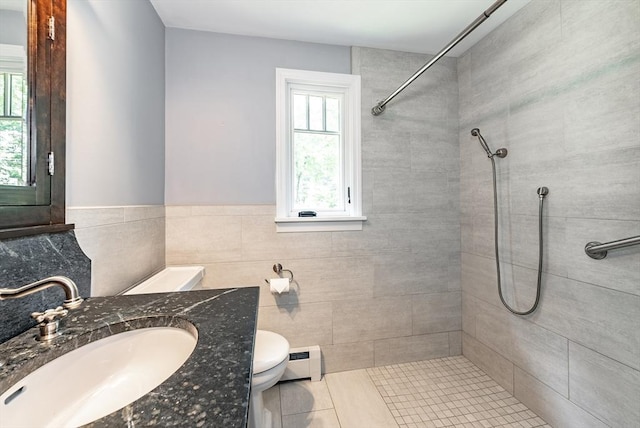 759 Williams St, Longmeadow, MA 01106 - full bath featuring tiled shower, a baseboard radiator, plenty of natural light, and vanity