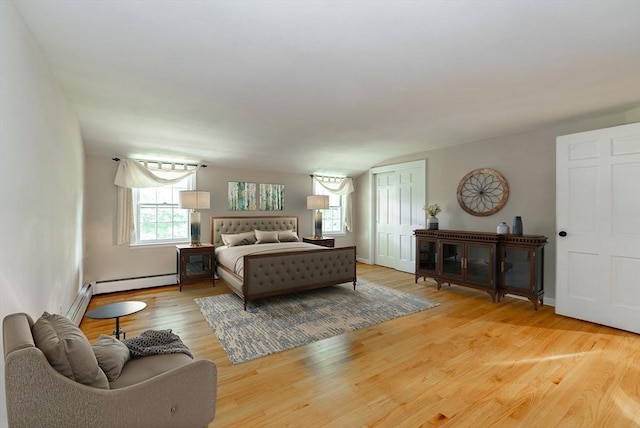 759 Williams St, Longmeadow, MA 01106 - bedroom featuring light wood-style floors, baseboard heating, and a closet