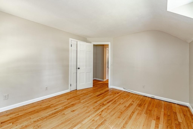 759 Williams St, Longmeadow, MA 01106 - unfurnished bedroom featuring light wood-style flooring and vaulted ceiling