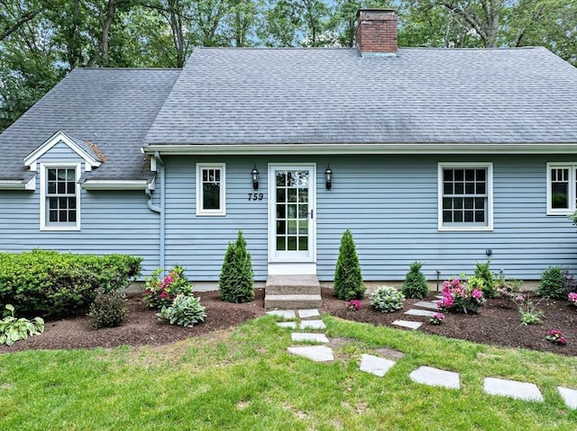 759 Williams St, Longmeadow, MA 01106 - view of front of house featuring a chimney, a shingled roof, and a front yard