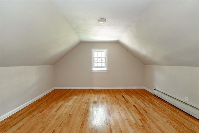 759 Williams St, Longmeadow, MA 01106 - additional living space featuring a baseboard heating unit, light wood-style flooring, and lofted ceiling