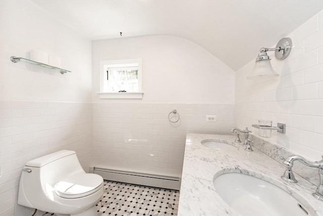 759 Williams St, Longmeadow, MA 01106 - bathroom featuring tile walls, baseboard heating, lofted ceiling, and double vanity
