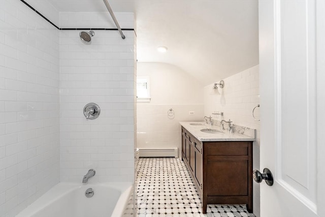 759 Williams St, Longmeadow, MA 01106 - bathroom with baseboard heating, tile walls, bathing tub / shower combination, vaulted ceiling, and double vanity
