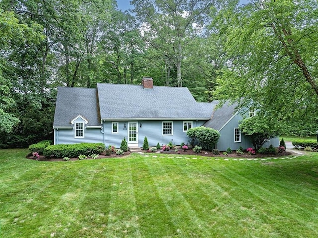 759 Williams St, Longmeadow, MA 01106 - view of front of property featuring a front yard, a chimney, and roof with shingles