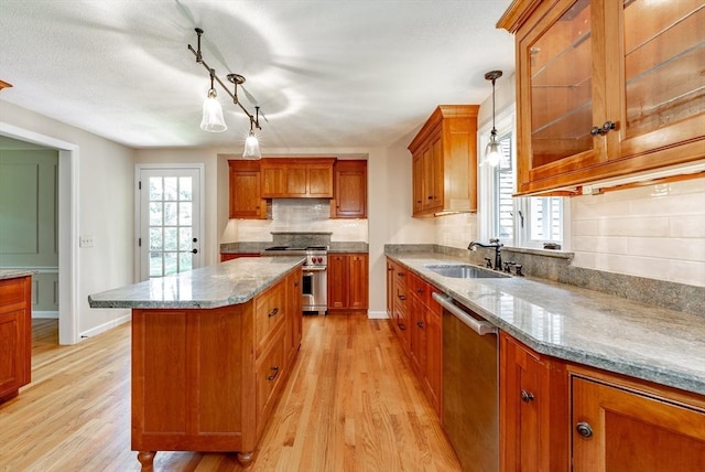 759 Williams St, Longmeadow, MA 01106 - kitchen with appliances with stainless steel finishes, light wood-style floors, brown cabinetry, and backsplash