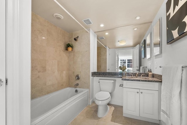 bathroom with visible vents, bathing tub / shower combination, toilet, tile patterned floors, and vanity