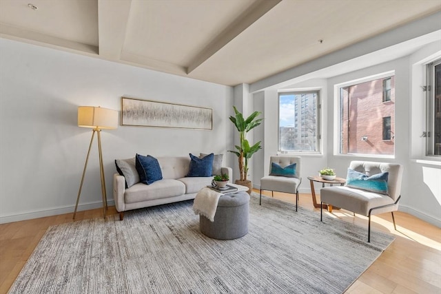 sitting room with wood finished floors and baseboards