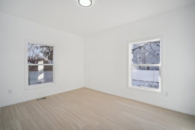 empty room with light wood-type flooring