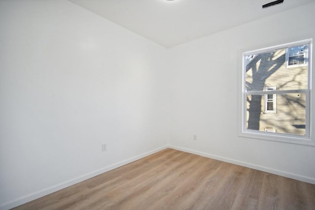 unfurnished room featuring light hardwood / wood-style flooring