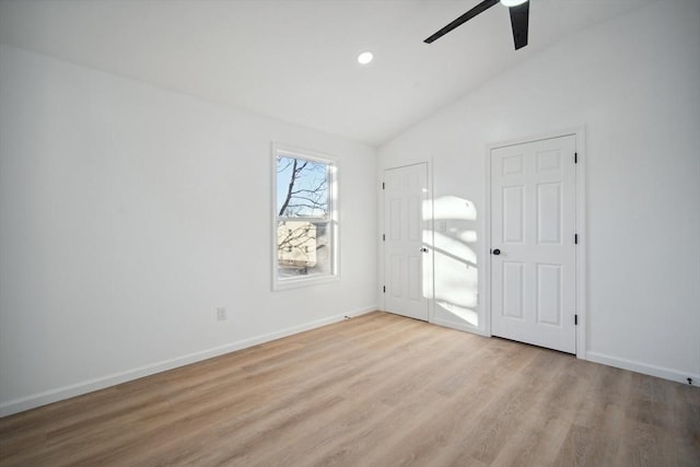 unfurnished room with vaulted ceiling, ceiling fan, and light hardwood / wood-style floors