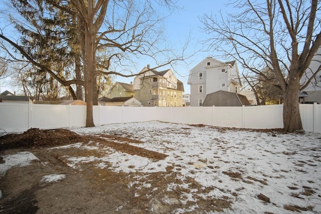 view of yard layered in snow