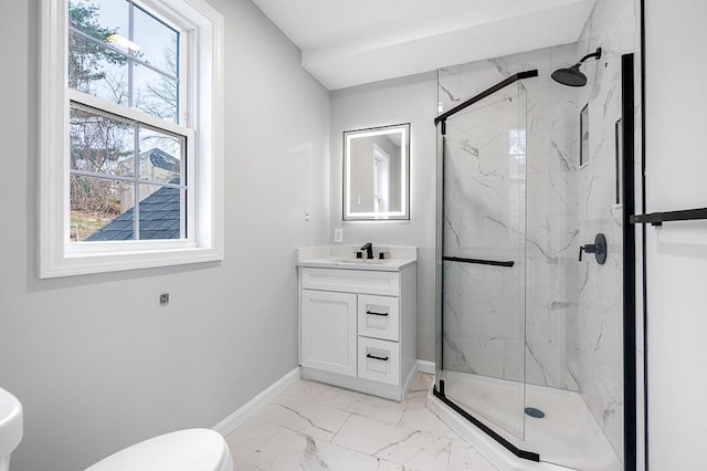 bathroom with vanity, baseboards, toilet, a marble finish shower, and marble finish floor