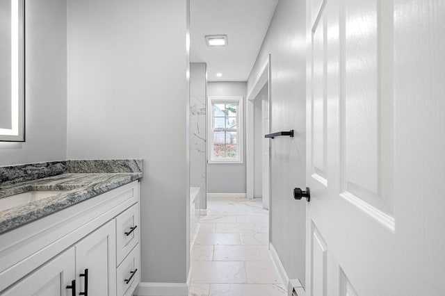 full bath featuring baseboards, recessed lighting, marble finish floor, and vanity