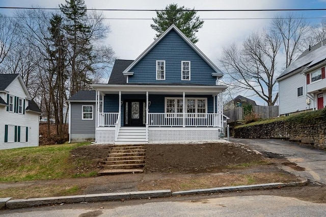 view of front of home with a porch and stairway