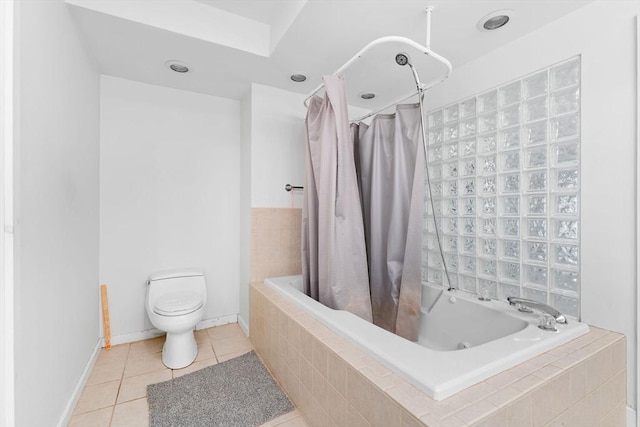 bathroom featuring baseboards, tiled shower / bath combo, toilet, and tile patterned floors