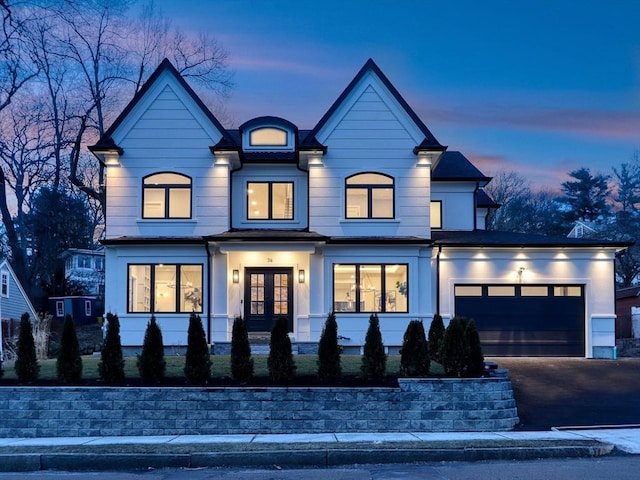 view of front facade with french doors and a garage