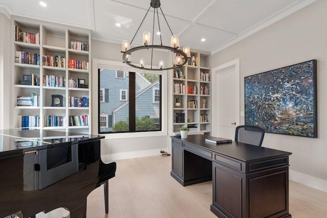 office with light hardwood / wood-style flooring, a notable chandelier, and crown molding