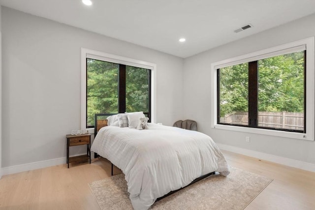 bedroom with light hardwood / wood-style flooring