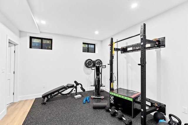 workout room with hardwood / wood-style floors and a healthy amount of sunlight