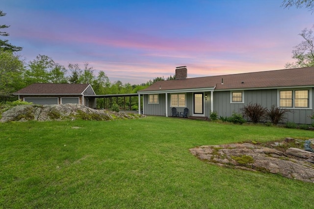 5 Indian Hl, Beverly, MA 01915 - back of house at dusk featuring a chimney, board and batten siding, a garage, a lawn, and a porch