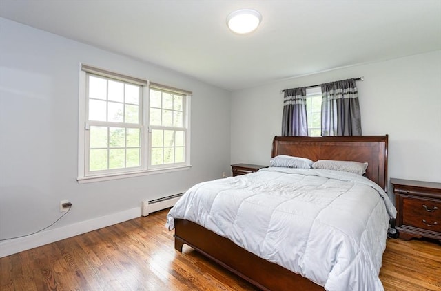 5 Indian Hl, Beverly, MA 01915 - bedroom with a baseboard heating unit, wood finished floors, and baseboards