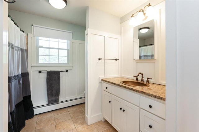 5 Indian Hl, Beverly, MA 01915 - bathroom with a baseboard heating unit, vanity, toilet, tile patterned floors, and curtained shower