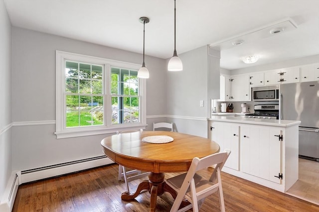 5 Indian Hl, Beverly, MA 01915 - dining space featuring a baseboard heating unit and light wood-style flooring