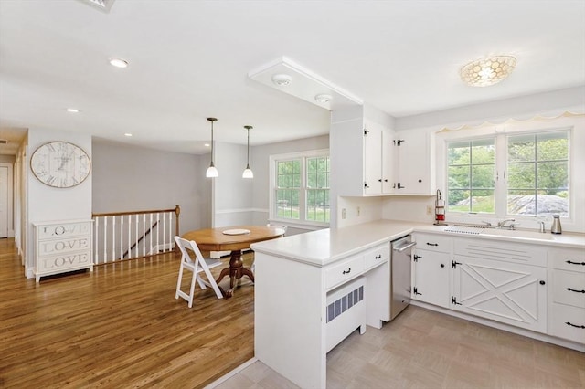 5 Indian Hl, Beverly, MA 01915 - kitchen featuring light countertops, dishwasher, white cabinets, a peninsula, and a sink