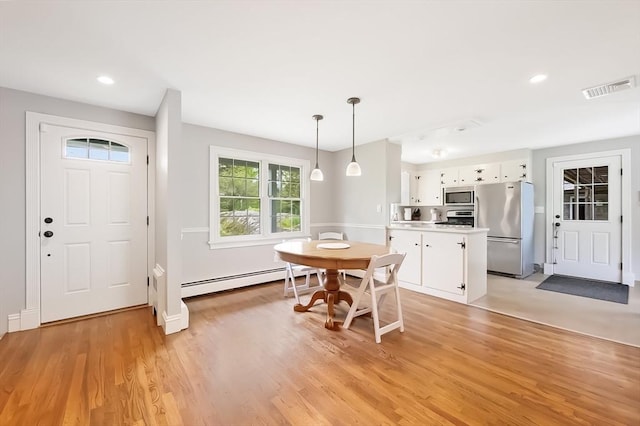 5 Indian Hl, Beverly, MA 01915 - dining space with a baseboard heating unit, light wood-style floors, recessed lighting, and baseboards