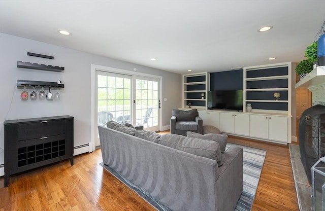 5 Indian Hl, Beverly, MA 01915 - living area with light wood-style floors, recessed lighting, a baseboard radiator, and a fireplace