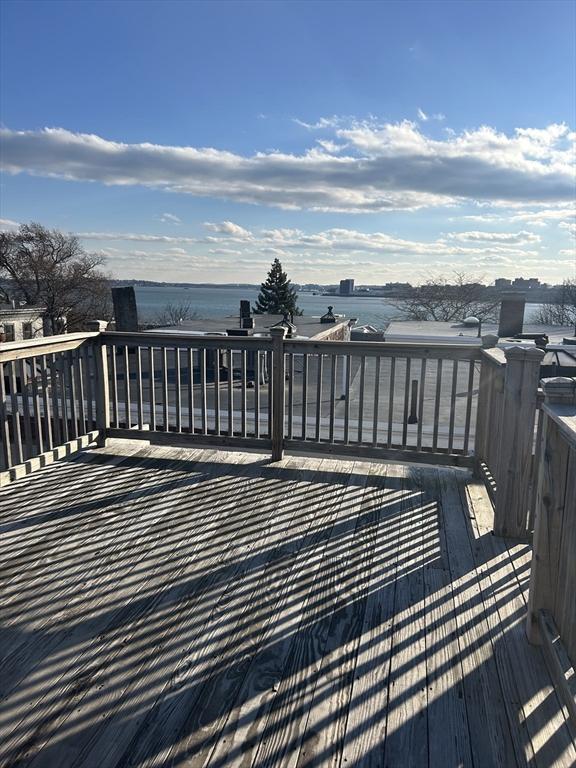 deck featuring a water view