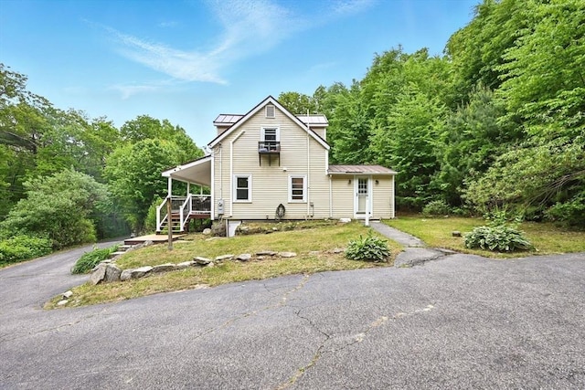 24 Barnett Rd, Sutton, MA 01590 - view of side of home featuring metal roof, a standing seam roof, and a forest view