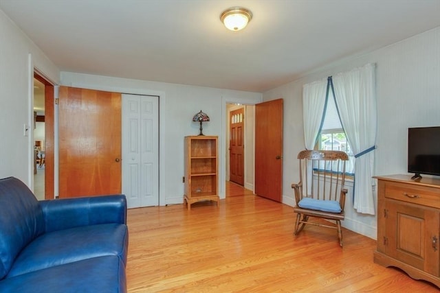 sitting room with light wood-type flooring