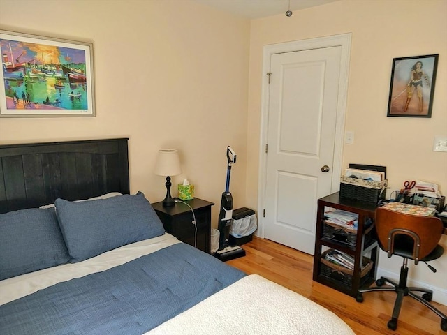 bedroom featuring wood finished floors