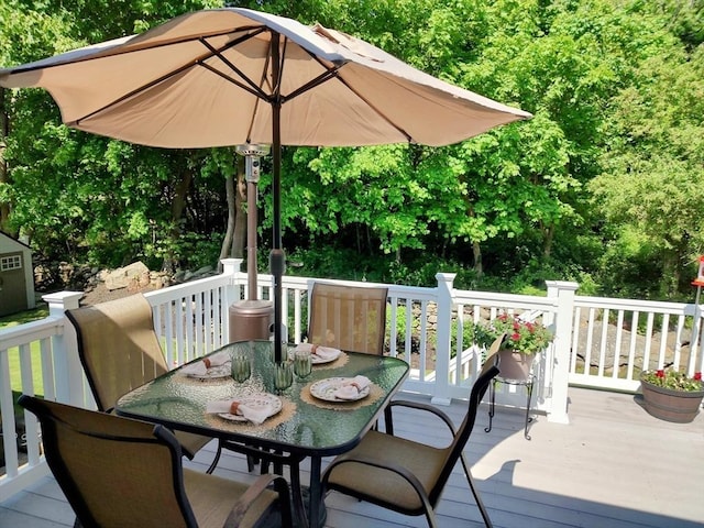deck featuring outdoor dining area