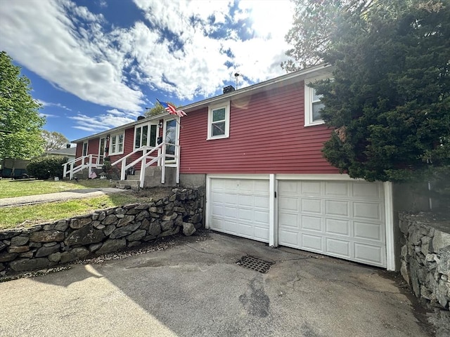 23 Rhodes Cir, Hingham, MA 02043 - ranch-style home featuring a garage and asphalt driveway