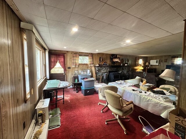 23 Rhodes Cir, Hingham, MA 02043 - bedroom with wood walls, carpet, and a wood stove