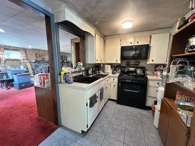23 Rhodes Cir, Hingham, MA 02043 - kitchen with black appliances, light countertops, a sink, light tile patterned floors, and light carpet