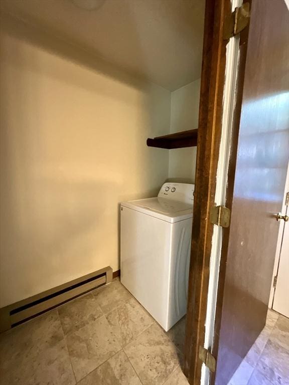 laundry area featuring washer / clothes dryer and a baseboard heating unit