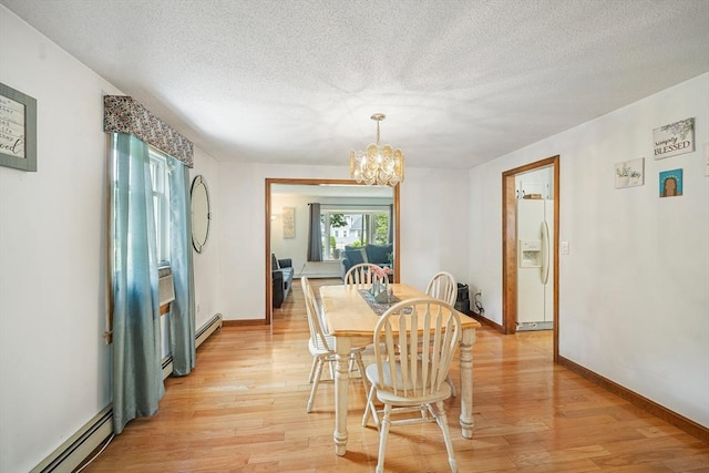 10 Manoogian Cir, Milford, MA 01757 - dining space with baseboard heating, a chandelier, light wood-style floors, and a textured ceiling