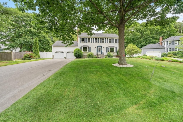 10 Manoogian Cir, Milford, MA 01757 - colonial house featuring a garage and asphalt driveway