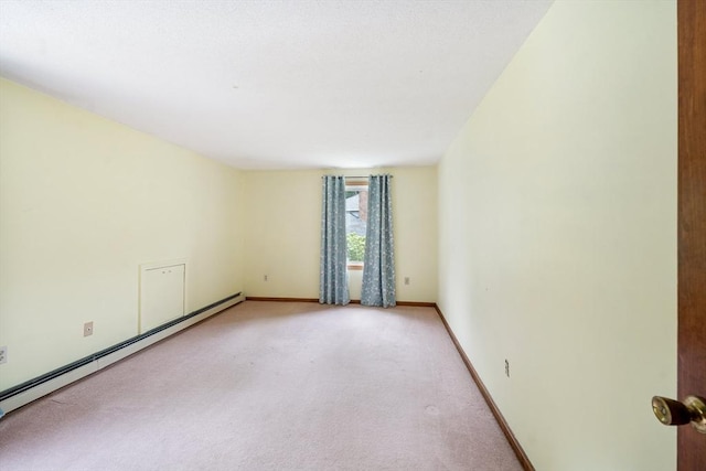 10 Manoogian Cir, Milford, MA 01757 - unfurnished room with baseboard heating and light carpet