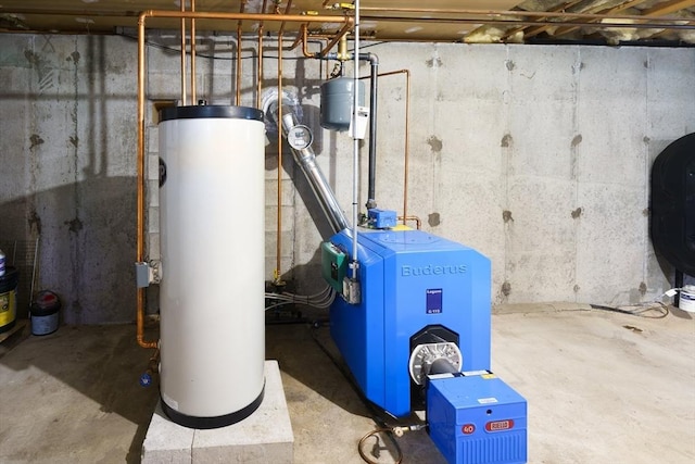 10 Manoogian Cir, Milford, MA 01757 - utility room featuring water heater, a heating unit, and heating fuel