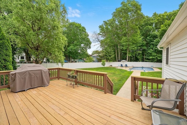10 Manoogian Cir, Milford, MA 01757 - wooden terrace with a grill, a fenced backyard, and a patio