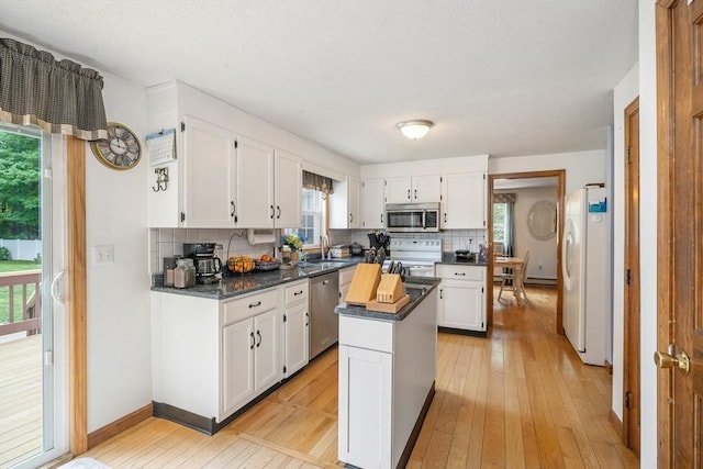 10 Manoogian Cir, Milford, MA 01757 - kitchen with stainless steel appliances, dark countertops, and backsplash