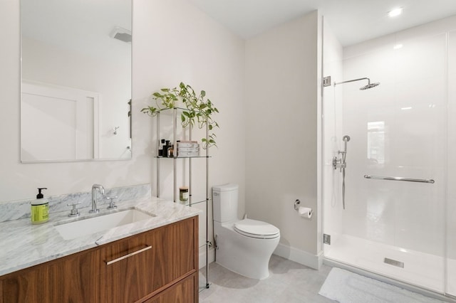 bathroom featuring a tile shower, vanity, toilet, and tile floors