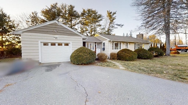 ranch-style house featuring a garage