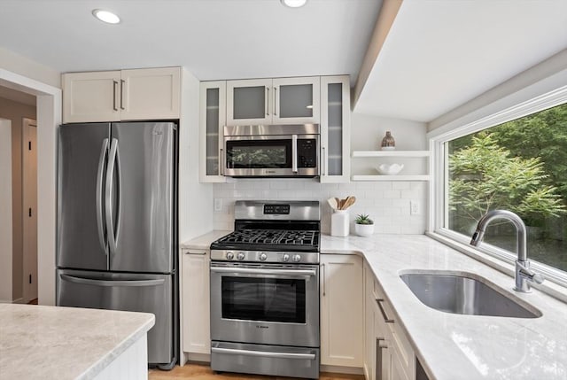 13 Long Ridge Rd, Acton, MA 01720 - kitchen with stainless steel appliances, decorative backsplash, light stone countertops, glass insert cabinets, and recessed lighting