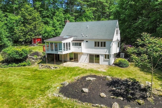 13 Long Ridge Rd, Acton, MA 01720 - back of property with a chimney, a lawn, a deck, and a shingled roof